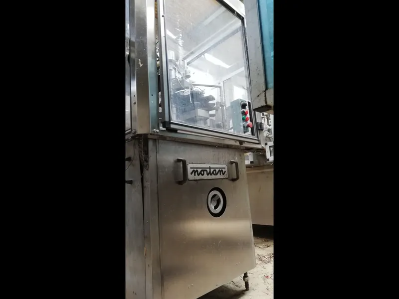 Photo #2 of Used Capsuling Machine Nortan UNICAP 35 S+R up to 1000 bph