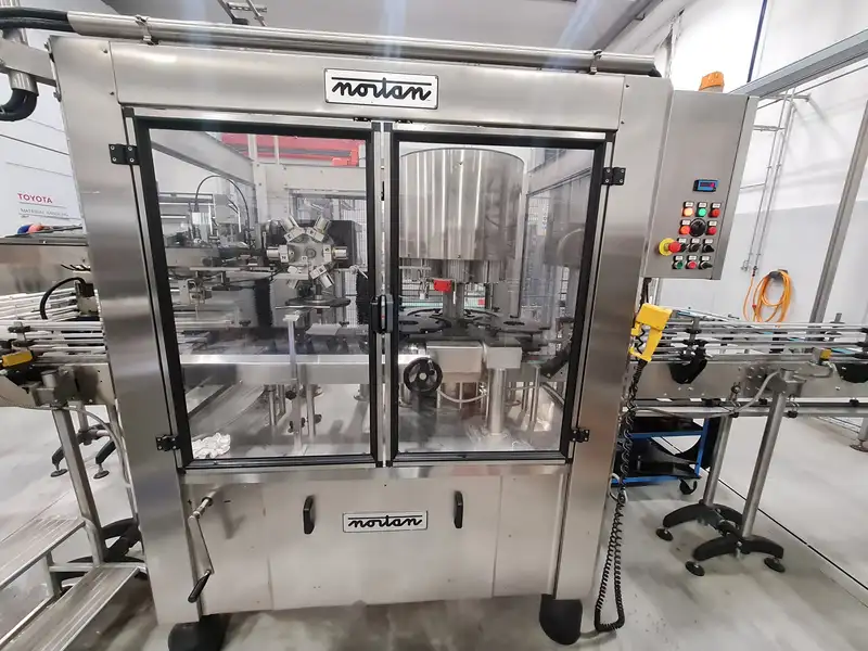 Photo #1 of Used shrinkable capsuling Machine NORTAN Prisma 80T